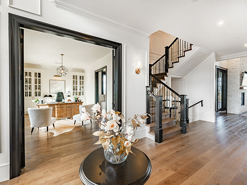 Foyer of a luxury home, opening up to an office.